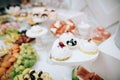 Delicious white wedding reception candy bar dessert table Royalty Free Stock Photo