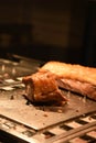 Delicious whole joint of cooked roast pork and crackling with a portion carved Royalty Free Stock Photo