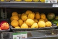 delicious yellow apricots in a black basket on a shelf at a market in Atlanta Georgia