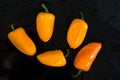 Delicious Yellow and Orange Peppers on Black Background Royalty Free Stock Photo