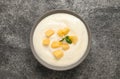 Delicious yogurt with fresh peach and mint on grey table, top view Royalty Free Stock Photo