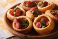Delicious Yorkshire puddings with sausage and peas closeup. hori Royalty Free Stock Photo