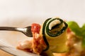 Delicious Zucchini Rollups filled with ricotta cheese and topped with fresh tomato marin Royalty Free Stock Photo