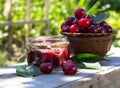 DeliciousCherry jam with fresh cherry on the background of the garden. Rustic weathered wood background Royalty Free Stock Photo