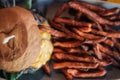 A deliciouse cheeseburger with fresh sweet potato fries.