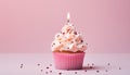 Deliciously decorated single birthday cupcake with pink candle on a light pink background Royalty Free Stock Photo