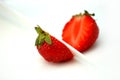 Deliciously red strawberries cut into half Royalty Free Stock Photo