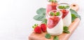 Delicous and nutritious double color colour strawberry desserts with mint and diced sarcocarp topping  with airy blue Royalty Free Stock Photo