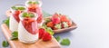 Delicous and nutritious double color colour strawberry desserts with mint and diced sarcocarp topping with airy blue