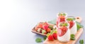 Delicous and nutritious double color colour strawberry desserts with mint and diced sarcocarp topping  with airy blue Royalty Free Stock Photo