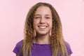 Delight, happiness, joy, victory, success and luck. Teen girl on a pink background. Facial expressions and people emotions concept Royalty Free Stock Photo