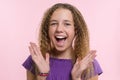Delight, happiness, joy, victory, success and luck. Teen girl on a pink background. Facial expressions and people emotions concept