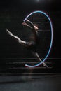 Delighted ballet dancer jumping with a colorful gymnastic ribbon Royalty Free Stock Photo