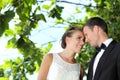 Delighted bride and groom flirting each other