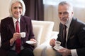 Delighted businesswoman having a break with her colleague Royalty Free Stock Photo