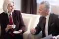 Delighted businesswoman having the conversation with her colleague Royalty Free Stock Photo