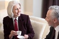 Delighted businesswoman having the conversation with her colleague Royalty Free Stock Photo