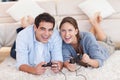Delighted couple playing video games Royalty Free Stock Photo