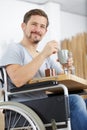delighted disabled having breakfast at home Royalty Free Stock Photo
