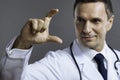 Delighted doctor showing gesture with his hand