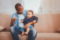 Delighted father babysitting his child Royalty Free Stock Photo