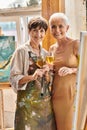 delighted female painter and stylish mature