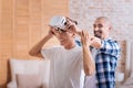 Delighted friends testing the virtual reality glasses