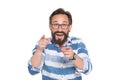 Delighted intelligent bearded man pointing at you with two forefingers Royalty Free Stock Photo