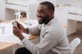 Delighted joyful man having a tablet in his hands