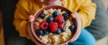 Delighted Kid Indulging In A Wholesome Morning Meal Of Oatmeal Porridge Topped With Fresh Berries