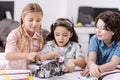 Delighted little scientists enjoying tech class at school