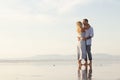 Delighted male and female couple spending time at beach
