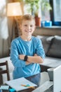 Delighted nice boy standing cross handed Royalty Free Stock Photo