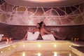 Delighted pleasant couple relaxing in the spa