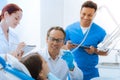 Delighted positive doctor treating his young patient Royalty Free Stock Photo