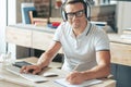 Delighted positive man holding a pencil Royalty Free Stock Photo