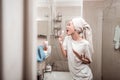 Delighted positive woman singing in the bathroom