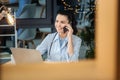 Delighted professional doctor having a phone conversation