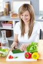 Delighted woman preparing a healthy meal