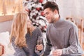 Delighted young couple celebrating New Years Eve