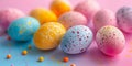A delightful array of speckled Easter eggs in bright pastel tones scattered on a dual pink and blue gradient background