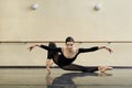 Ballerina posing in dance hall