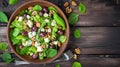 Delightful Blue Cheese, Grape, and Nuts Salad: A Tempting Visual Treat in Top View on a Wooden Backg Royalty Free Stock Photo