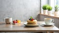 A delightful breakfast scene featuring a stack of pancakes adorned with fresh berries and a couple of mugs of tea alongside a Royalty Free Stock Photo
