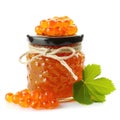 Delightful cloudberry jam marmalade jelly preserves in a glass jar, accompanied by fresh cloudberries, displayed on a clean white
