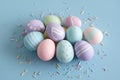 Pastel Easter Eggs Decorated with Sprinkles on Blue Background Royalty Free Stock Photo