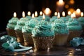 Delightful cupcake ensemble Blue candled, heart topped, and crowned with green cupcakes