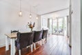 A delightful dining room with black leather chairs