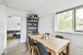 Delightful dining room for four with wooden table