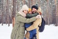 Delightful family hugging each other showing the truly love while spending time outdoors